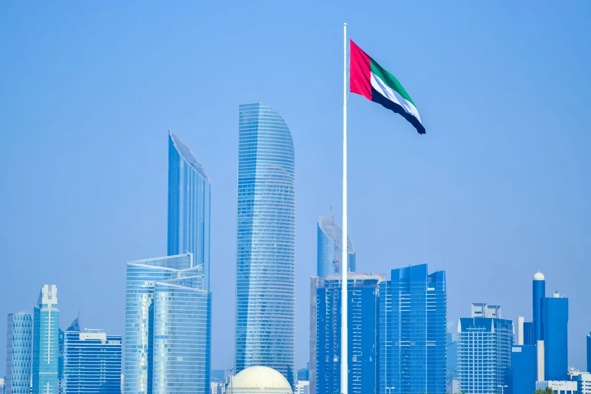 The Abu Dhabi skyline with the United Arab Emirates flag flying