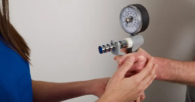 Ms Michelle Razo using a Jamar dynamometer to measure grip strength during a Hand Therapy assessment